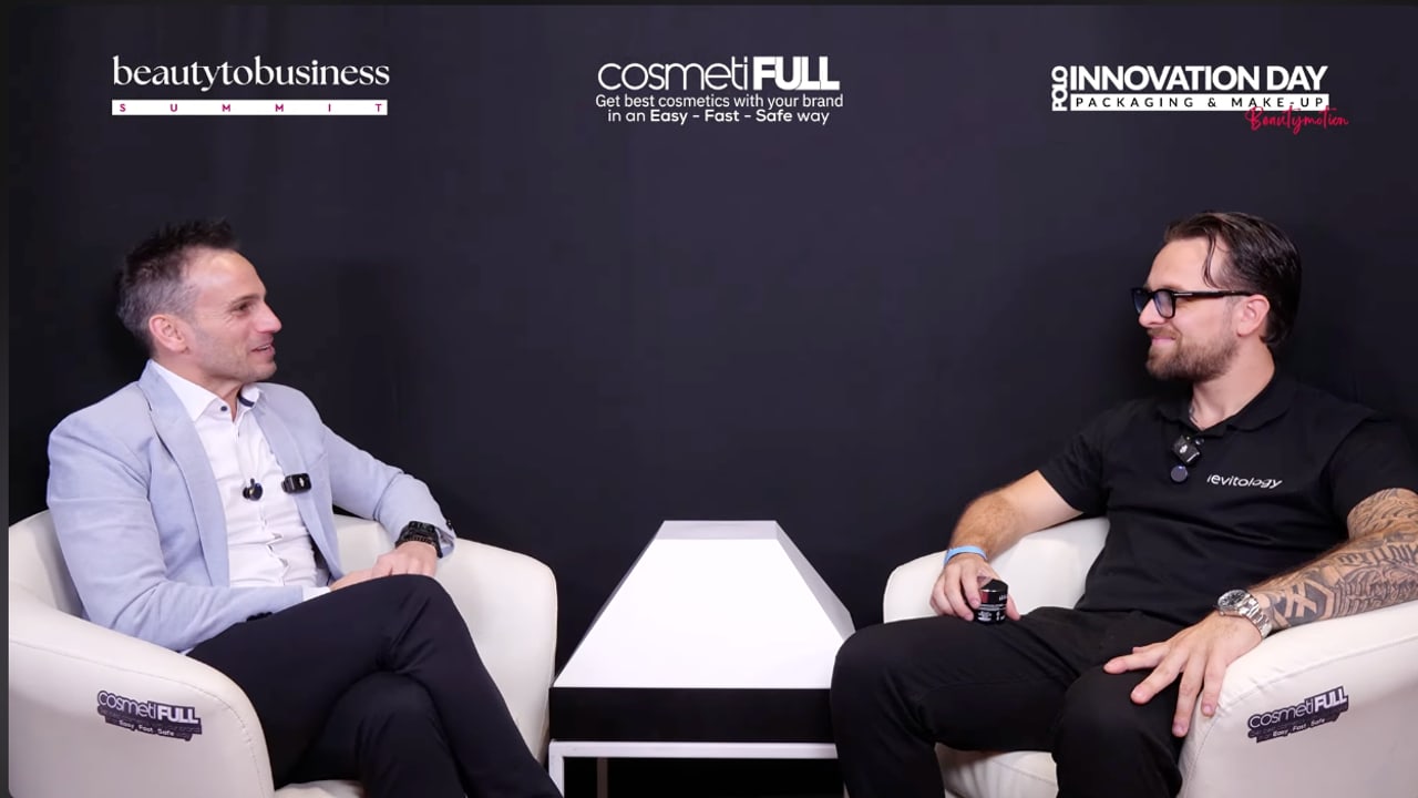 Claudio Nicodemo interviewing a guest on the cosmetINSIDER set at the Beauty To Business Summit